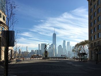 City street with modern buildings in background against sky