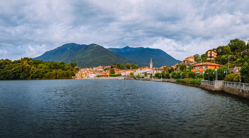 View of the village of mergozzo on the homonymous lake with cloudy sky