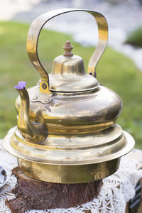 Copper vintage teapot and banana cream cake at picnic outdoor,vintage background