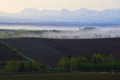 Scenic view of mountains during foggy weather