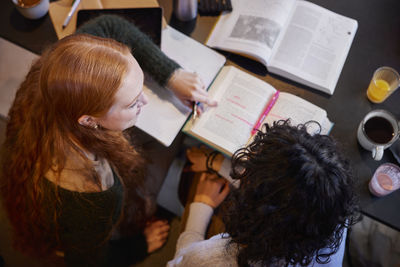 High angle view of young women studying together