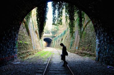 People walking in tunnel