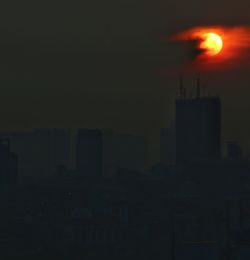Silhouette of city at night