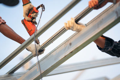 Low angle view of man against built structure