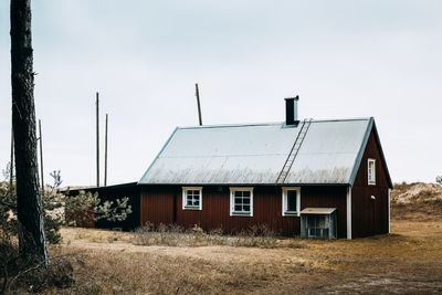 House on field against sky