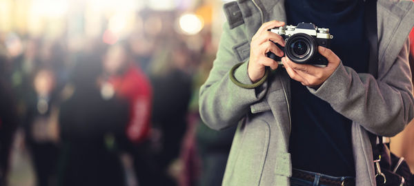 Man photographing camera