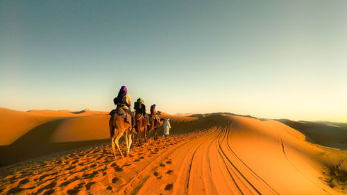 Scenic view of desert against sky during sunset