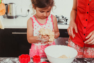 High angle view of girl having food at home