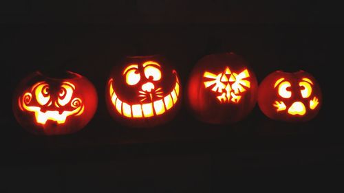 Close-up of illuminated pumpkin against black background