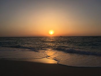 Scenic view of sea against clear sky during sunset