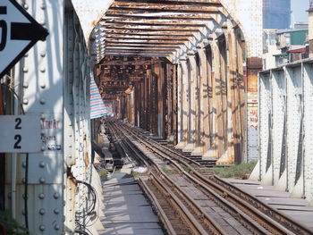 Rusty railroad tracks at railway bridge