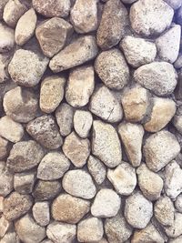 Full frame shot of pebbles on sand