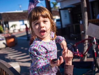 Portrait of girl standing outdoors