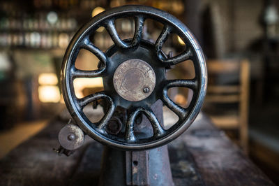 Close-up of sewing machine on table