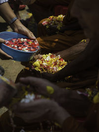 The hand of the thai people poured water in the hands of the monk songkran festival.