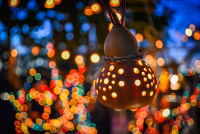 Close-up of illuminated christmas lights at night