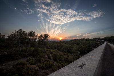 Scenic view of landscape against sky during sunset