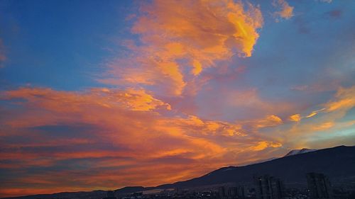 Low angle view of dramatic sky during sunset