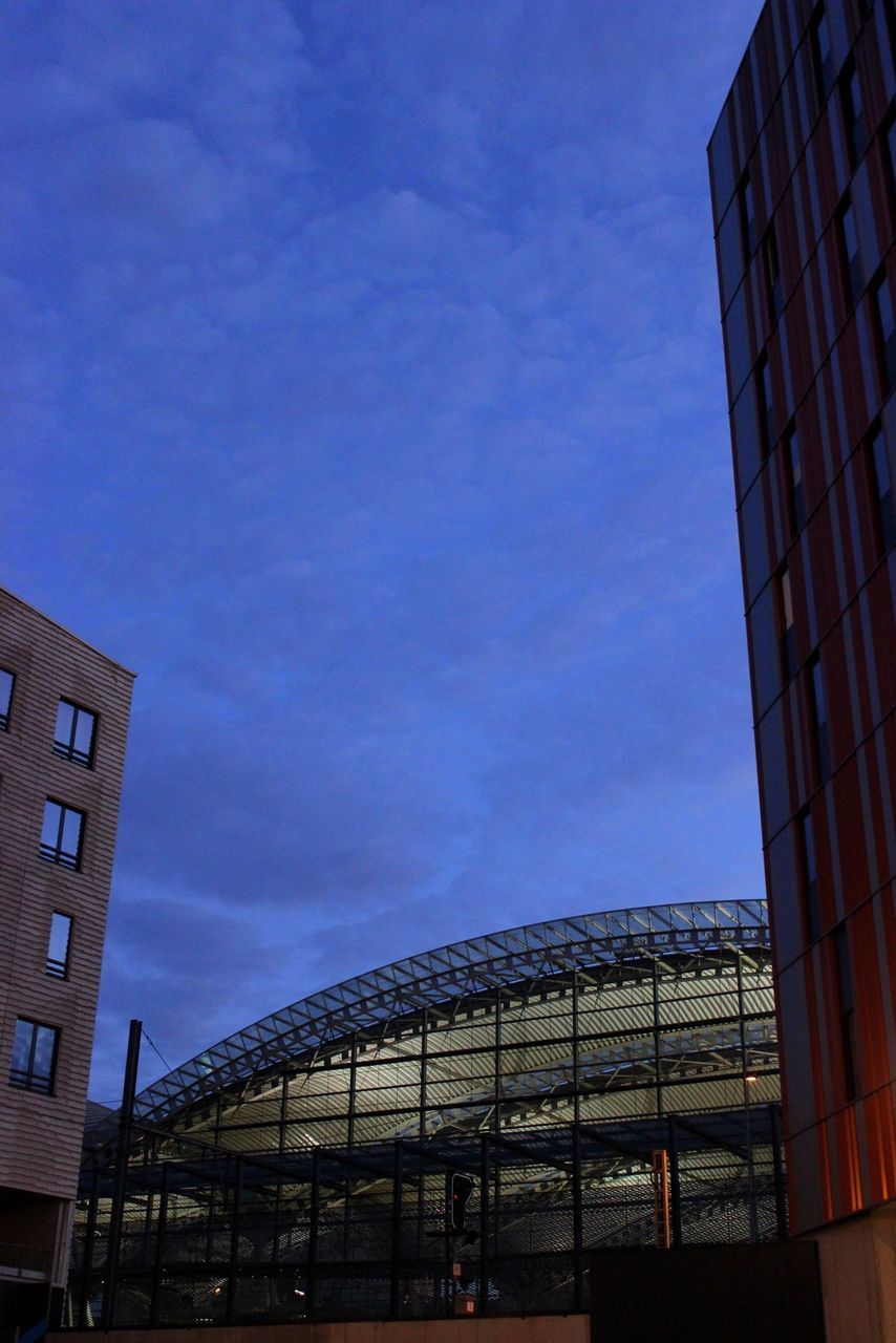 architecture, built structure, building exterior, low angle view, sky, city, building, blue, modern, cloud, window, outdoors, cloud - sky, office building, day, city life, no people, residential building, glass - material, residential structure