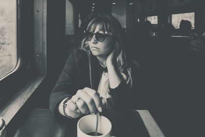 Young woman sitting in restaurant