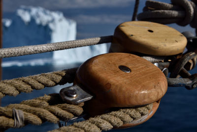 Close-up of rope tied on wood