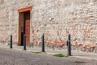 Door and brick wall . sidewalk in old town