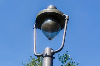 Low angle view of street light against clear blue sky