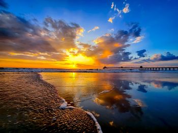 Scenic view of sea against sky during sunset with reflection