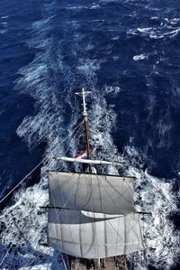 High angle view of sailboat sailing in sea