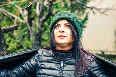 Portrait of smiling young woman in park