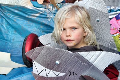 Portrait of boy playing with toys at home