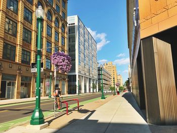 Street amidst buildings in city against sky