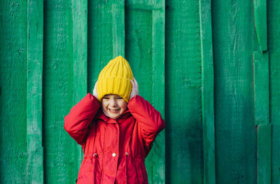 Girl holding her head with her hands clenching her teeth. child in a stressful environment. 