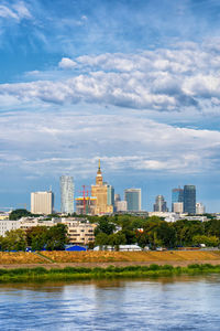 Modern buildings in city against sky