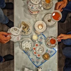 High angle view of people on table