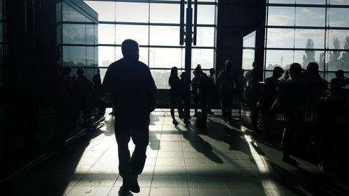 Silhouette people in waiting room at ostkreuz