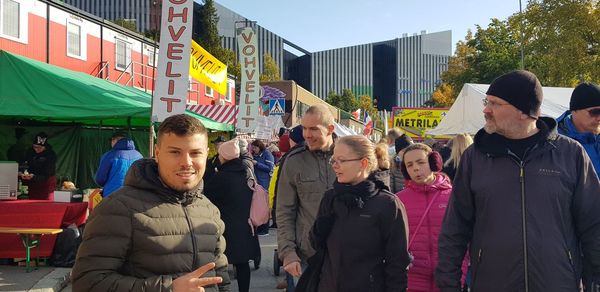 People standing on street in city