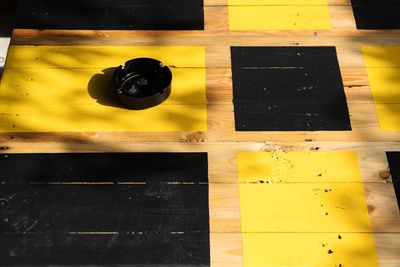 Close-up of yellow paper on table
