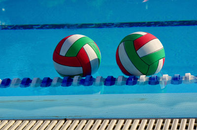 Close-up of ball swimming pool against sea