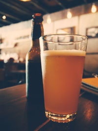 Close-up of beer glass on table