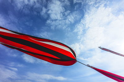 Low angle view of flag against sky