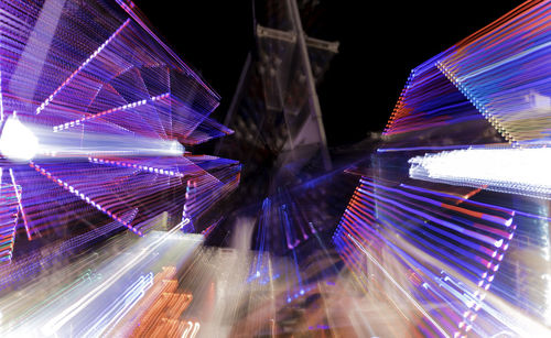 Low angle view of light trails at night