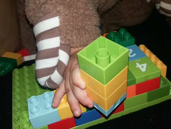 Low section of person with toy toys