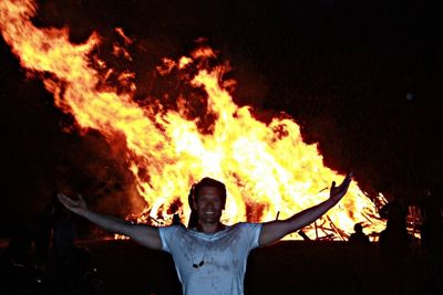 Silhouette of bonfire at night