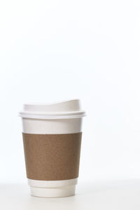 Close-up of coffee cup against white background