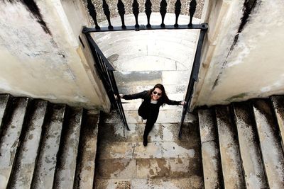 High angle view of beautiful woman standing on entrance