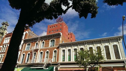 Low angle view of building against blue sky