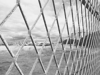 Close-up of metal against sky