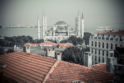 View of buildings in city against sky