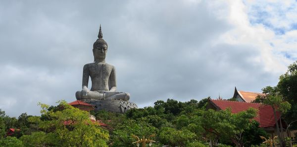 Low angle view of statue against sky